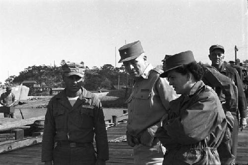 Soldiers on walk way having discussion