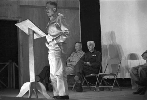 Soldier at podium reading speech