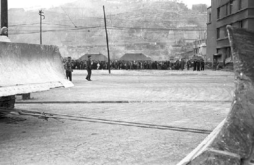 Portrait of Civilians lined up in full from afar