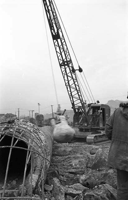 Wrecking ball smashing concrete