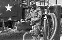 Soldier pumping gas into truck