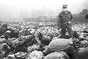 Soldier walking through bags of luggage 2