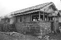 Portrait of stone wall around house