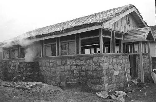 Portrait of stone wall around house