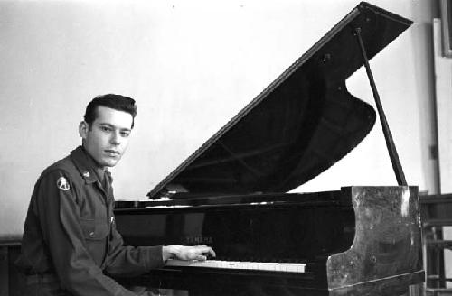 Portrait of soldier playing piano 2