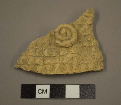 Corrugated potsherd with applied decoration