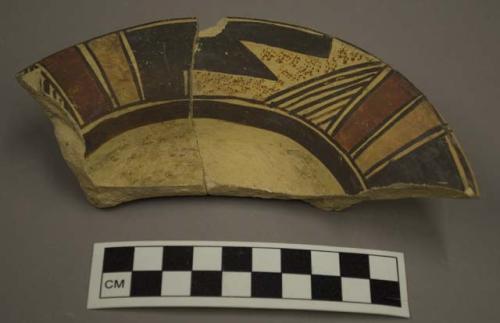 Restored sherd--one half plate with ring base. Late Sikyatki