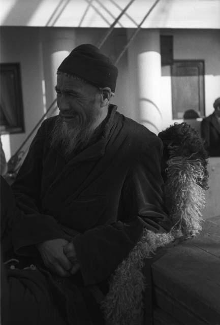 Bearded man sitting on boat