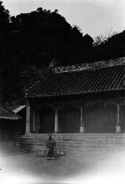 Man standing in front of temple