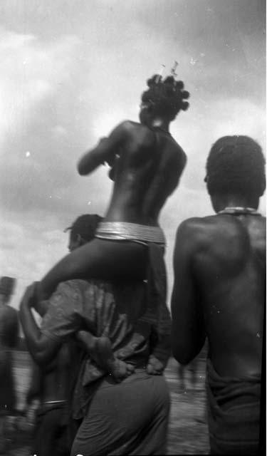 Girl being carried to Sande bush school