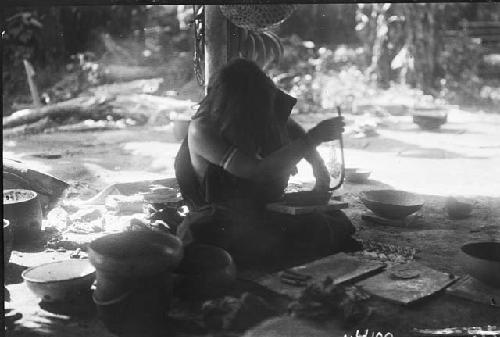 Woman making pottery