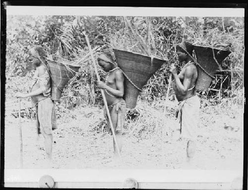 Three Zulu children with tools