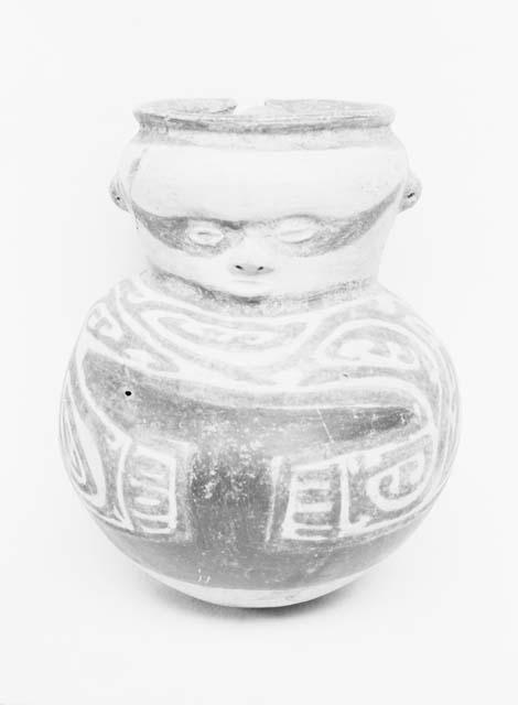 Polychrome human effigy jar from grave 26, number 122