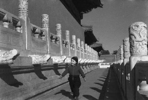 Marble balustrade, side of main T'ai Miao hall, with David Lattimore