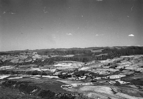 Landscape with hills, river and cultivated fields