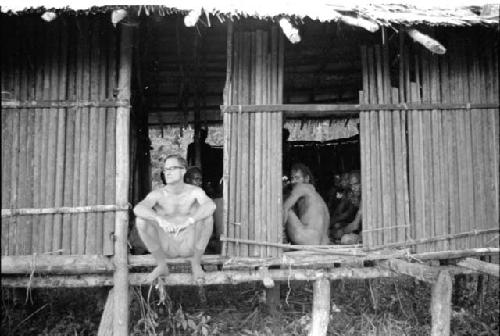 Dr. A. A. Gerbrands seated in the doorway of the government rest house