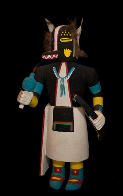 Katsina (badger), painted wood with feathers and string attached