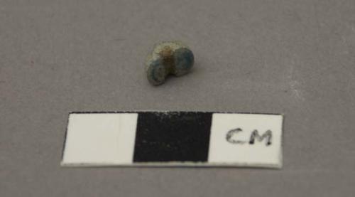 Glass bead fragment, blue, round.