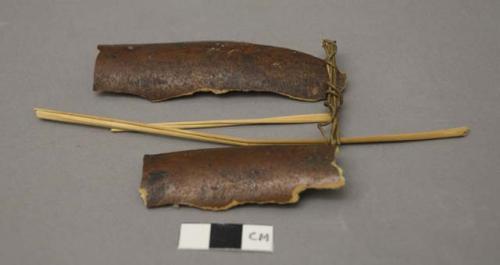 Gourd, straw, twisted vegetable fiber, & feather fragments