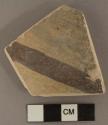 Reused black-on-yellow potsherd