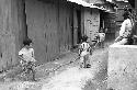 Portrait of three children playing with long rope