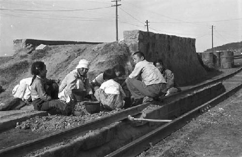 Workers working on railroad