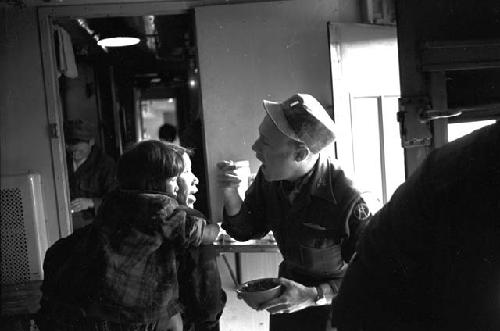 Soldier directing girl during treatment