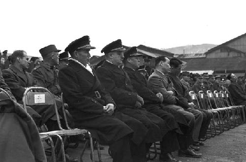 Officers in audience listening to speech