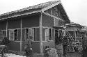 Portrait of soldiers exiting house outside