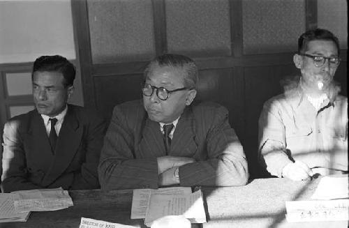 Portrait of suits listening during meeting