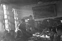 Portrait of soldier standing at middle of table