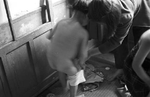 Child being undressed