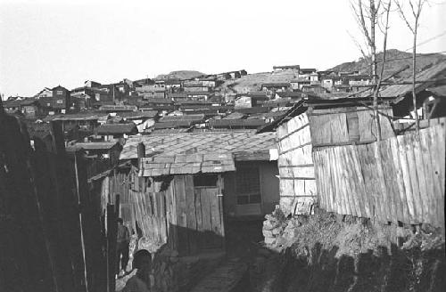 View of homes rising on hill