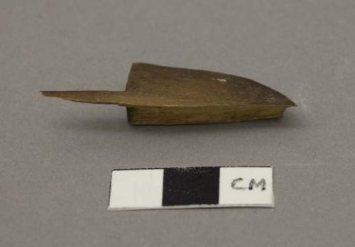 Carved wooden implement, flat, broken.