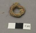 Ring of thread, multicolor, loosely coiled, dirty
