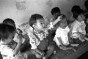 Potrait of babies sitting side by side together