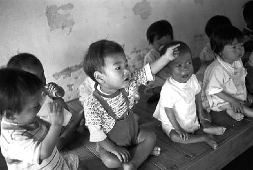 Potrait of babies sitting side by side together