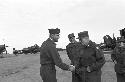 Soldiers greet each other on the air strip