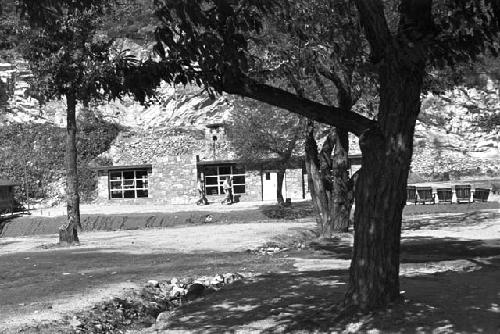 Building at the end of road by water