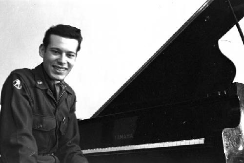 Portrait of officer at piano facing camera