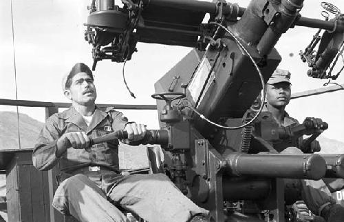 Soldiers operating canon launcher