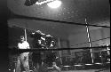 Portrait of boxers fighting in ring from ropes