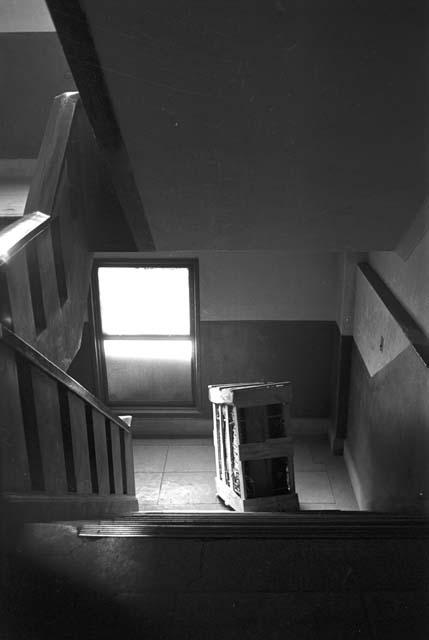 Portrait of large box in stairway