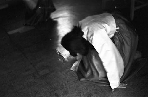 Portrait of dressed up child kneeling on floor