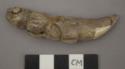 Carved bone, restored alligator figure