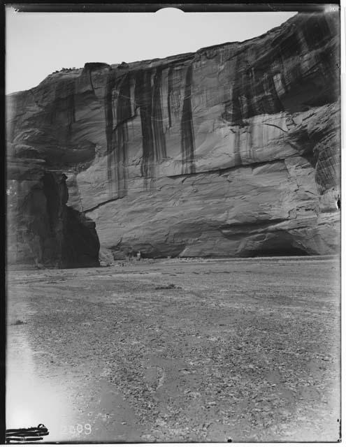 Ruins at base of cliff and stairs on wall