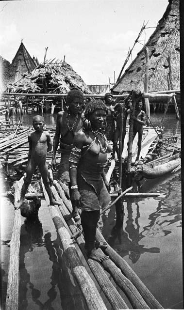 Women and children on dock