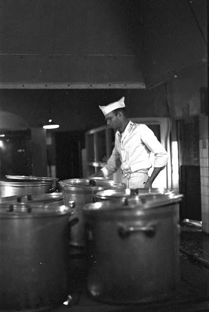 Chef in kitchen cooking