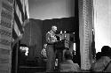 Portrait of soldier at podium adressing audience