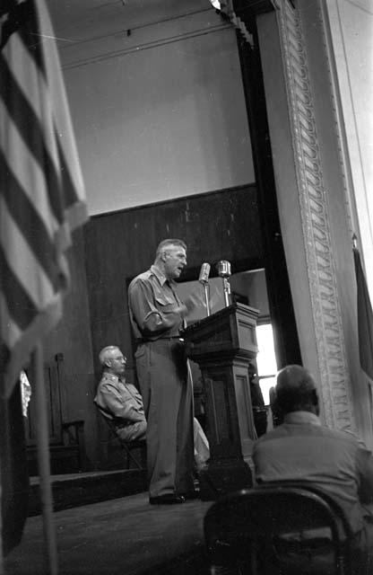 Portrait of soldier at podium adressing audience 4